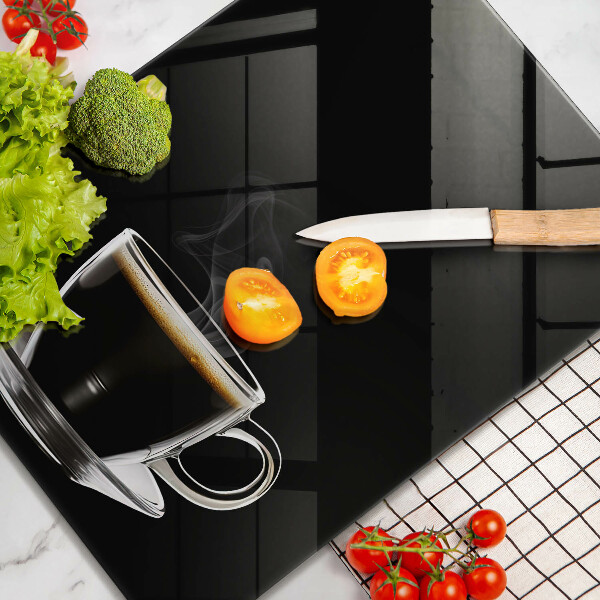 Üveg vágódeszka Egy pohár forró kávé