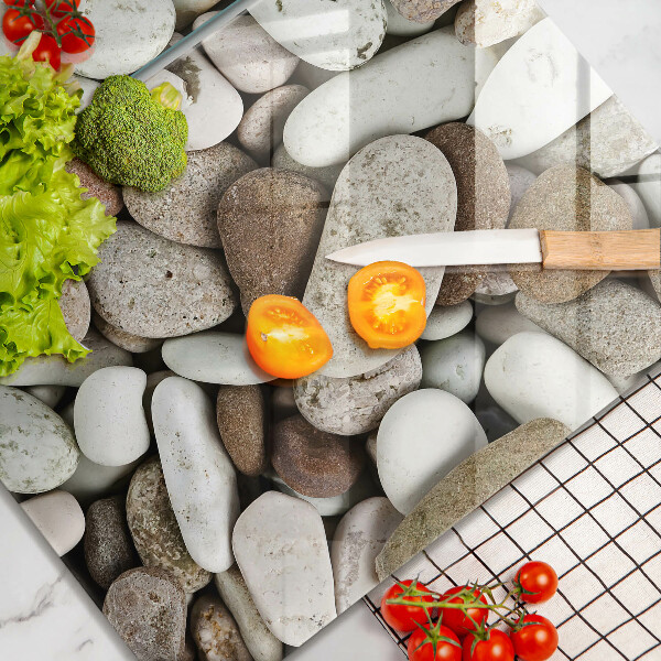 Üveg vágódeszka Kis kövek háttér