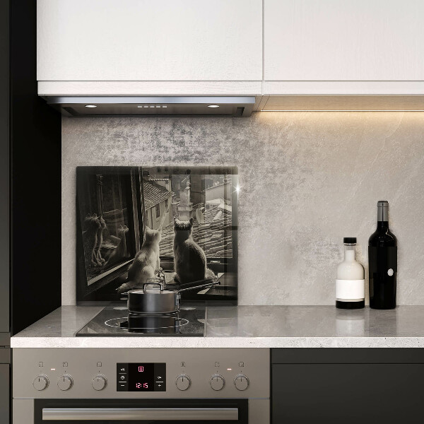 Tűzhelyvédő üveglap Macskák város és ablak