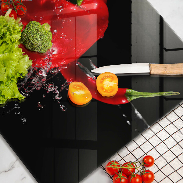 Tűzhelyvédő üveglap Piros paprika vízben