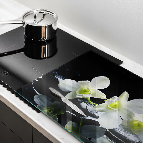 Tűzhelyvédő üveglap Fehér virágok a zen vízben